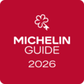 Michelin Guide 2026 Logo mit weißem Schlüsselblumen-Symbol auf rotem Hintergrund